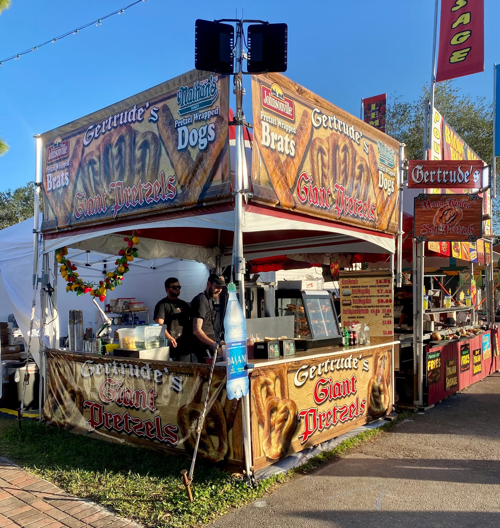Hands twisting pretzel dough into traditional shape